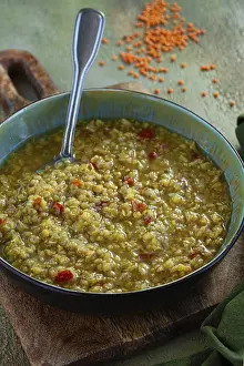 Lentil soup, in a bowl on a wooden board
