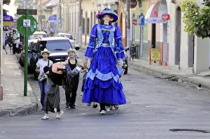 Leon, Nicaragua, Black-winged Stilt walker in elaborate blue and green costume