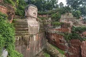 Leshan, China - July 2019 : The close up of the head and torso of the Giant Leshan Buddha