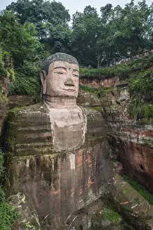 Leshan, China - July 2019 : The close up of the head and torso of the Giant Leshan Buddha
