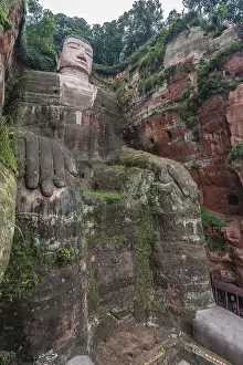 Leshan, China - July 2019 : The close up of the head and torso of the Giant Leshan Buddha