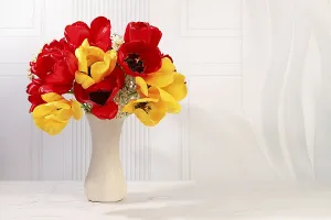 Still life with beautiful spring blooming tulips in vase on elegant background