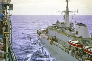 Light jackstay transfer from HMS Glamorgan to HMS Triumph to port, Atlantic Ocean, Royal Navy, slide dated February 1972