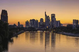The lights of Frankfurt's banking skyline begin to glow in the evening after sunset