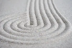Lines and circle formation on beach sand with customizable space for text