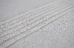 Lines formation on beach sand with customizable space for text