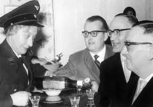A liquor for three men with 50's eyeglasses