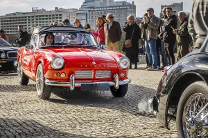 Lisbon, Portugal, Jan 20, 2024: Classic Triumph Spitfire 4 car on a cobblestone road during Classic English Cars parade