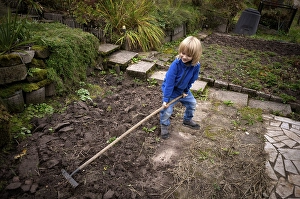 Little boy, 6 years, blonde, gardening