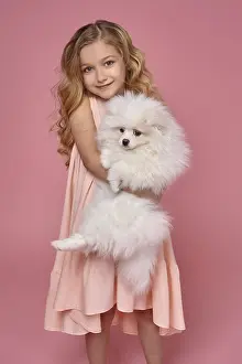 Little girl with a blond curly hair