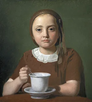 A little girl, Elise Koebke, with a cup in front of her