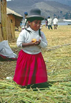Little girl on a floating Uro island in Lake Titcaca