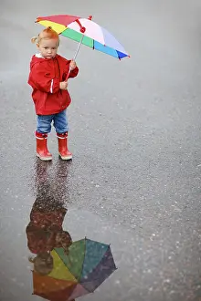 A little girl with an umbrella
