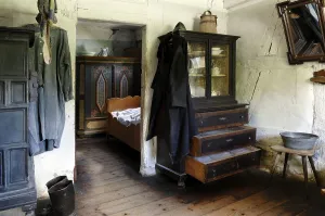 Living room, 1926, with fireplace and display cabinet at the back the sleeping chamber