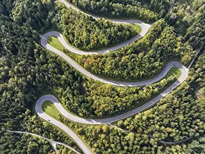 Lochenpass, winding pass road through a forest area