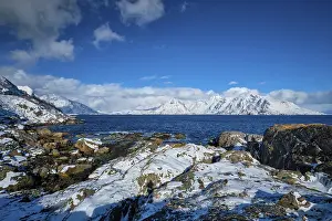 Lofoten islands and Norwegian sea in winter with snow covered mountains