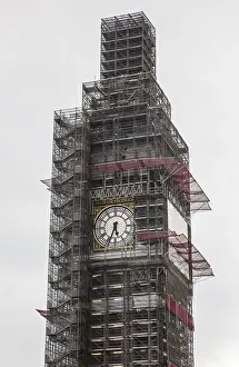 London, Big Ben scaffolded tower upper storeys with freely visible clock