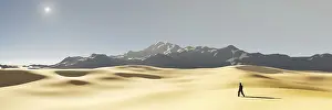A lonely man in the dry sunset desert