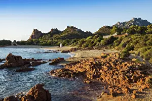 Lonely picturesque beach and red rocks