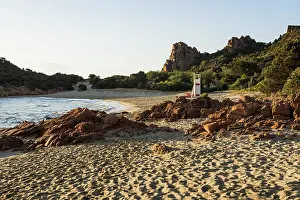 Lonely picturesque beach and red rocks