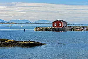 Framed Print : Lonely red wooden house at a bay near Bud