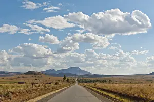Long straight road, vast arid landscape