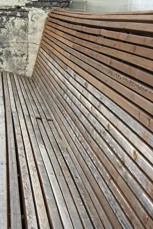 Long wooden empty bench, side view