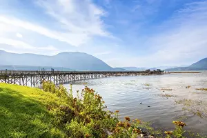 Long wooden pier stretching into the calm waters of shuswap lake