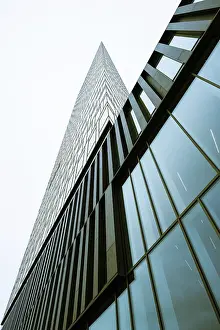 Looking up a tall scyscraper glass facade