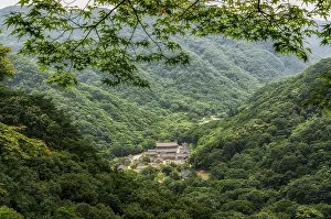 Looking down at a temple in Korea from top of a mountain