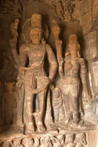 Lord Shiva with his consort Parvati sculpture in cave one in Badami