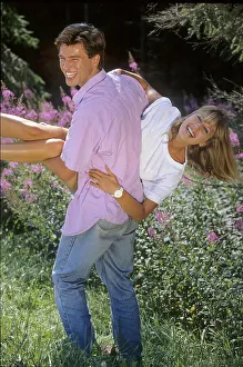 Lovers in the forest, he carries her on his hands