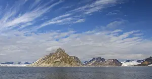 Luciapynten, mountain with steep sea cliffs in Hornsund fjord in summer