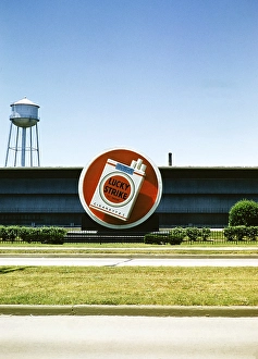 Lucky Strike cigarette advert, Philip Morris tobacco factory, probably in Durham, North Carolina. USA around 1953