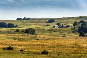 Lush green and golden fields extend across the landscape
