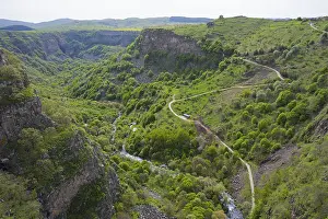 Framed Print : Lush green gorge with winding paths along which a river flows Framed Print : Lush green gorge with winding paths along which a river flows