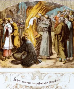 Luther publicly burns the papal bull of excommunication from Pope Leo X