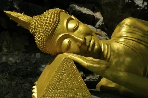 Category Buddhism Prints: Lying head of the reclining Buddha in the Wat Tham Temple