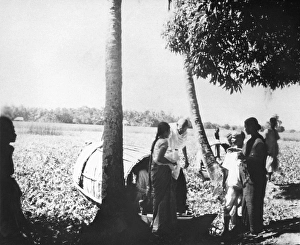 Mahatma Gandhi, accompanied by Abha Gandhi leaving a boat during his visit in the riot effected area of Noakhali East Bengal