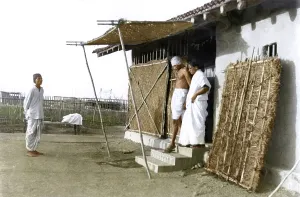 Mahatma Gandhi with Amtus Salam leaving his hut, Wardha, Maharashtra, India, Asia, 1939, Asia