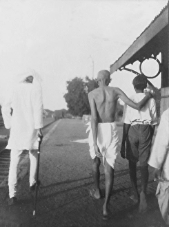 Mahatma Gandhi arriving at a wayside railway station, 1929