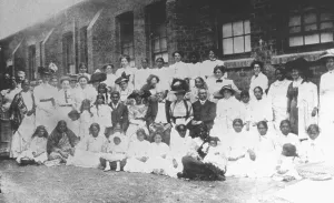 Mahatma Gandhi center left during a function of a women's bazaar in South Africa