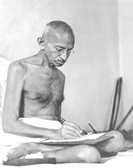 Mahatma Gandhi drafting a document at Birla House