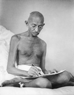 Mahatma Gandhi drafting a document at Birla House