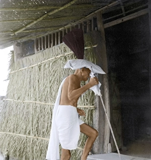 Mahatma Gandhi entering hut, Wardha, Maharashtra, India, Asia, 1941, Asia