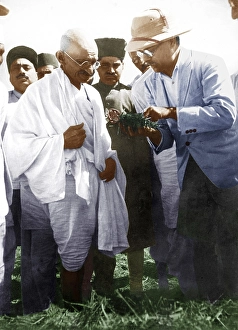 Mahatma Gandhi getting farm compost shown, explained by farm superintendent, India, Asia, 1930, Asia