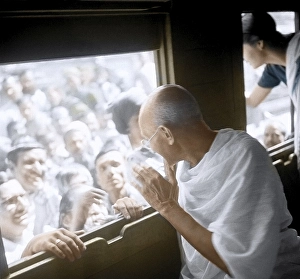 Mahatma Gandhi greeting people through train window way to Allahabad, India, Asia, November 18, 1939, Asia