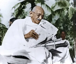 Mahatma Gandhi reading papers during visit to Noakhali, Bangladesh, Asia, November 1946, Asia