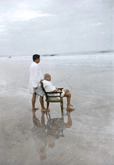 Mahatma Gandhi sitting on chair and Devdas Gandhi on Juhu Beach, Mumbai, Maharashtra, India, Asia, May 1944, Asia
