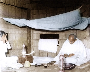 Mahatma Gandhi sitting writing in his hut, Assam, India, Asia, December 1946, Asia